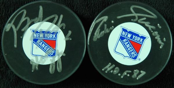 Brad Park & Eddie Giacomin Signed Pucks 