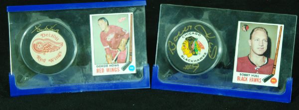 Gordie Howe & Bobby Hull Single-Signed Puck Displays (2)