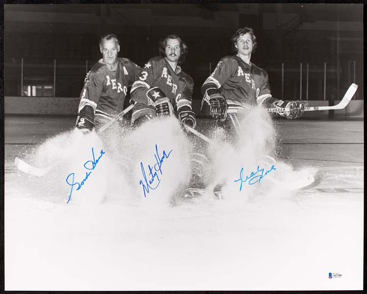 The Howe Family Multi-Signed 16x20 Photo (BAS)