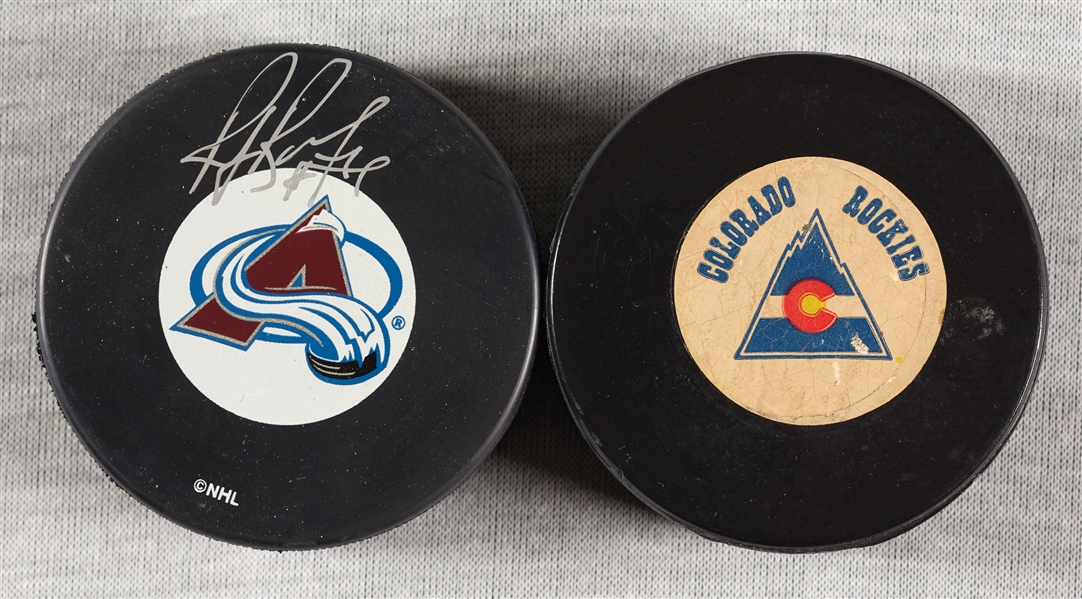Ray Bourque Signed Avs Hockey Puck, with Old Colorado Rockies Puck (2) (JSA)